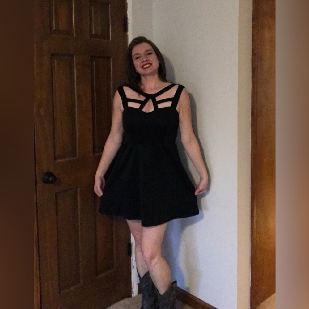 Fun party little black dress. Can be dressed to any style from boots to heels.